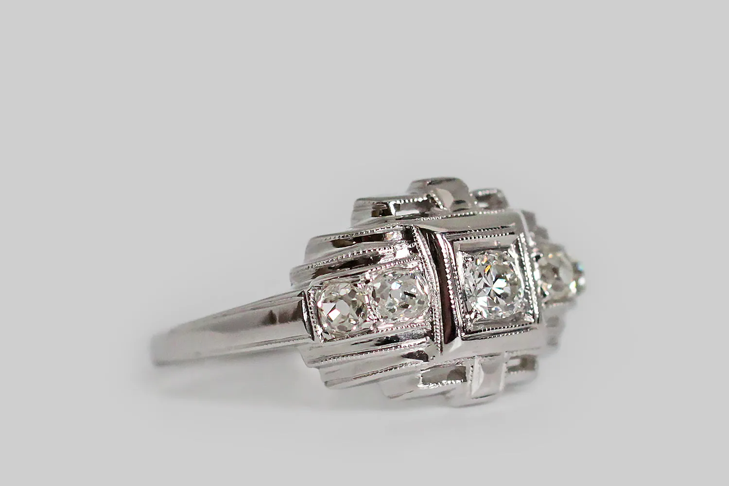 Art Deco Era Five Diamond Temple Engagement Ring in Platinum